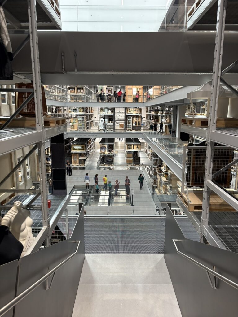 View of the V&A East storehouse looking out across three floors and the collection objects